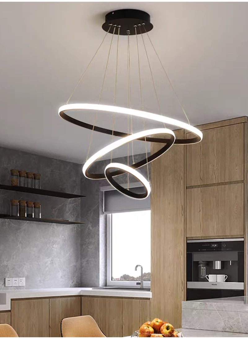 An LED chandelier composed of three light rings, stylish and simple. It has three light colors, adjustable in shape, and can be controlled by remote control or switch. It is suitable for above the dining table, living room, bedroom and study. - Image 5